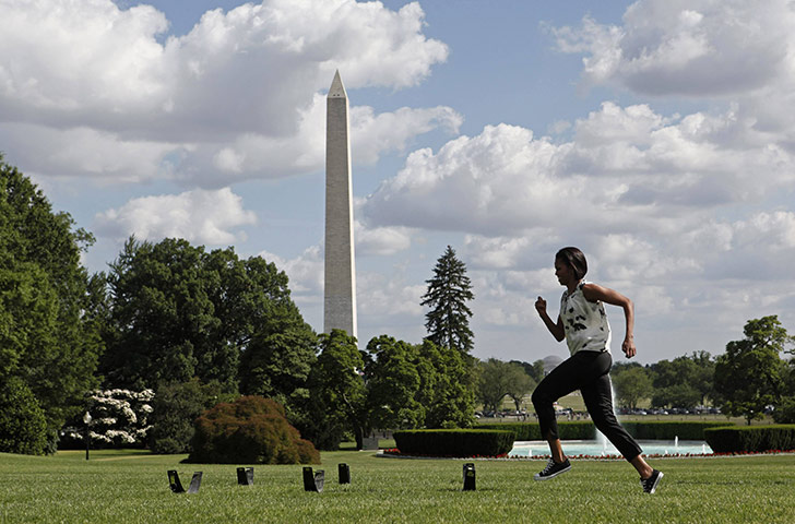 Michelle Obama fitness: First lady Michelle Obama runs across the South Lawn