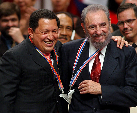 Hugo Chávez and Fidel Castro share a medallion in 2005