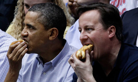 Barack Obama and David Cameron each eat hot dogs at NCAA basketball tournamnet game in Ohio