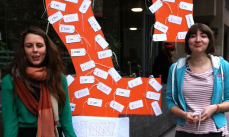 King's College London students pin the hidden costs of their studies to a huge pound sign.