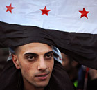 A Syrian migrant attends a rally against President Bashar al-Assad at the Syrian embassy in Sofia