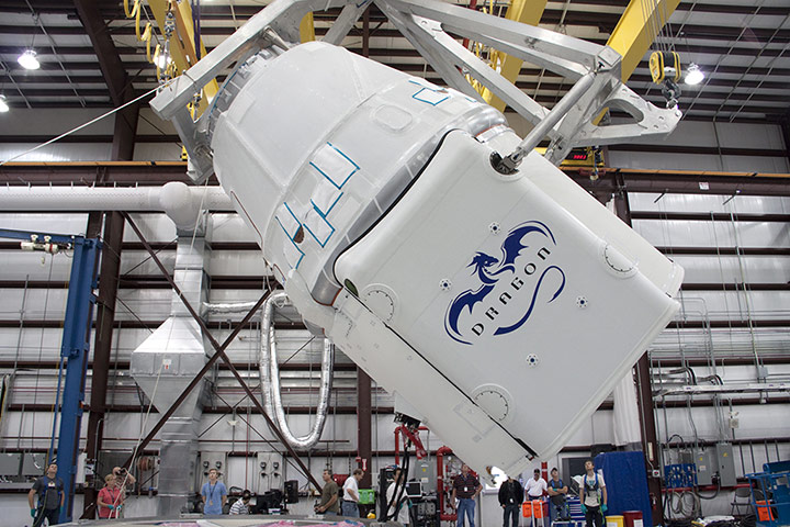 SpaceX Falcon 9: Dragon Prepared to Fly.In a processing facility at Cape Canaveral