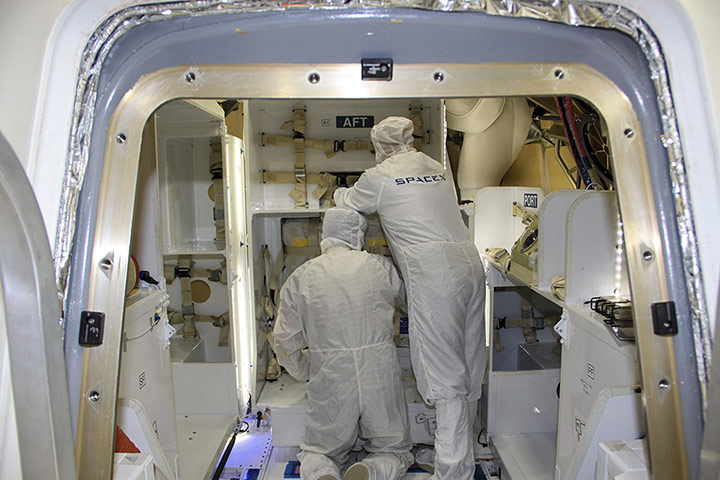 SpaceX Falcon 9: Dragon Prepared to Fly.In a processing facility at Cape Canaveral