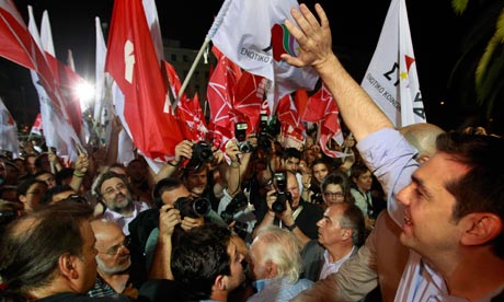 Head of Greece's radical left SYRIZA party Tsipras waves to supporters in Athens