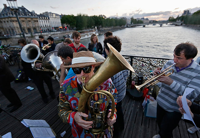 week in music: A man plays a tuba on the Pont des Arts