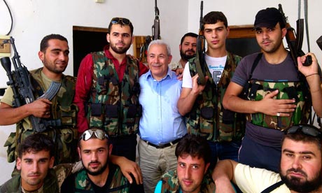 Syrian National Council leader Burhan Ghalioun  poses  with Syrian free army in Sarmada