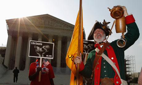 Tea party supporter Temple shouts against the healthcare overhaul outside the Supreme Court 