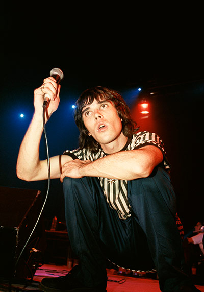 Stone Roses Book: Ian Brown of the Stone Roses performing at Glasgow Green, 1990