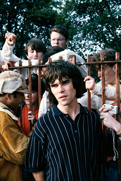 Stone Roses Book: Ian Brown of the Stone Rose with fans at Spike Island, 1990
