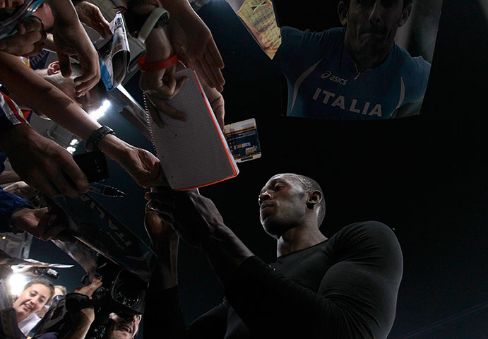 Usain Bolt: Bolt of Jamaica signs autographs 