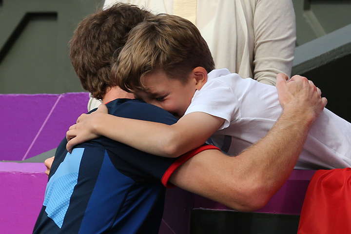 team GB celebrations: Eleven-year-old Henry Caplan from Essex hugs Andy Murray 