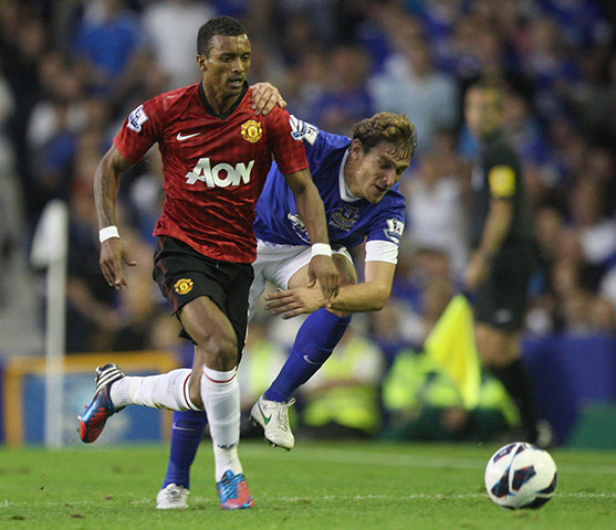 Man Utd gallery: Nani looks to get away down the wing despite pressure from Nikica Jelavic 