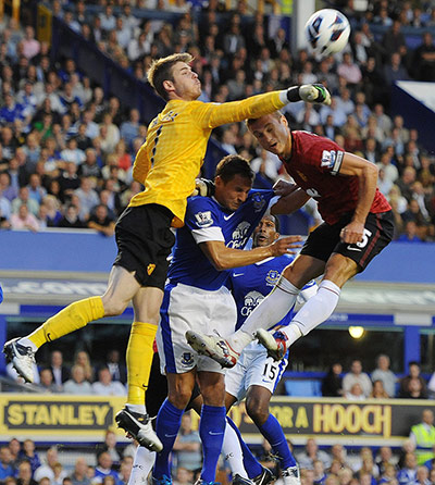 Man Utd gallery: David De Gea punches clear from Nikica Jelavic and Nemanja Vidic