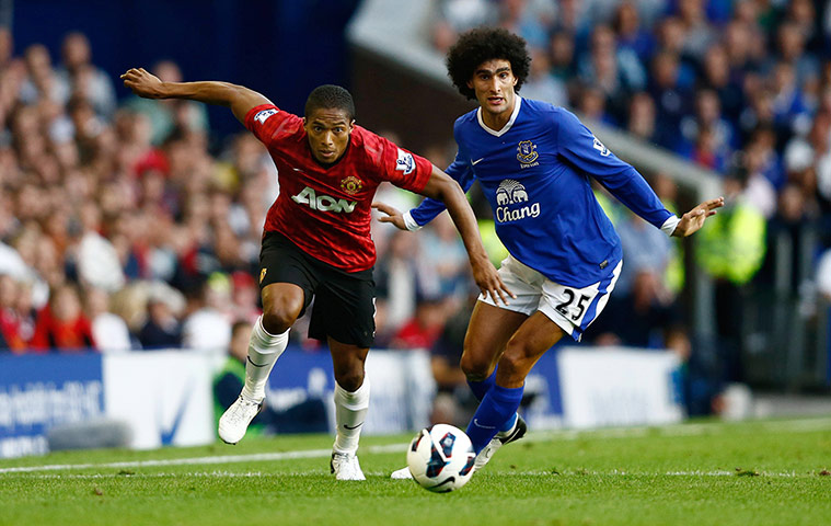 Man Utd gallery: Antonio Valencia skips past Marouane Fellaini