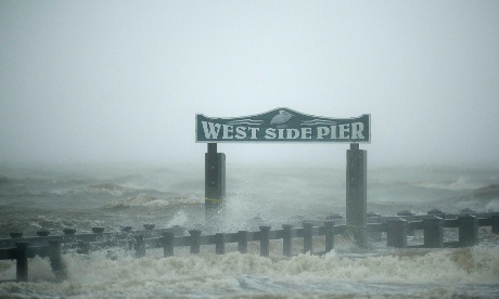 Surf washes over the West Side Pier as Hurricane Isaac passes through Gulfport, Mississippi.