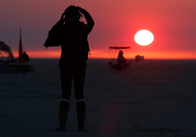 Burning Man: Libriel Padilla watches the sunrise at Burning Man