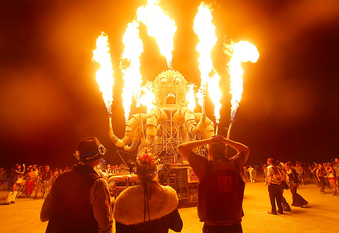 Burning Man: Festival goers watch the flames from El Pulpo Mecanico 