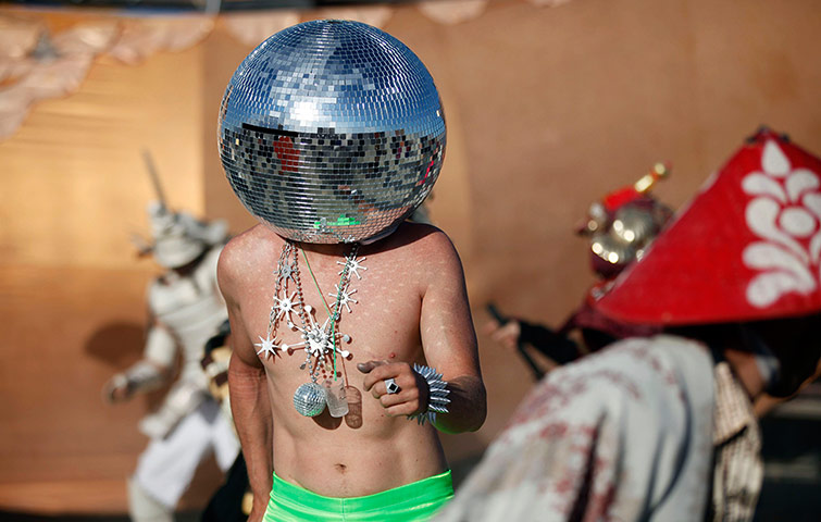 Burning Man: Ciberfy, his play name, dances at sunrise during the Burning Man Festiva