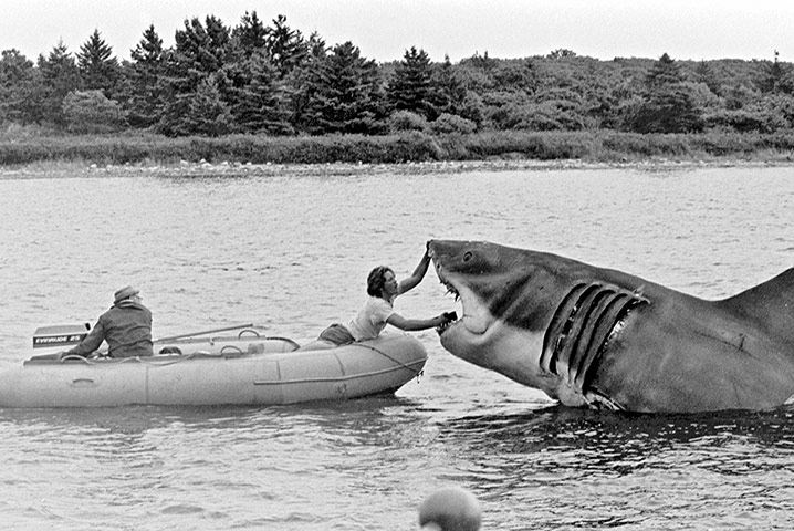 Jaws: Bob Mattey (steering boat) and Richie Helmer touch up the shark