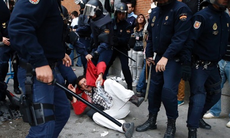 A protester screams as he is dragged away by police after police charged demonstrators outside the the Spanish parliament in Madrid, September 25, 2012.