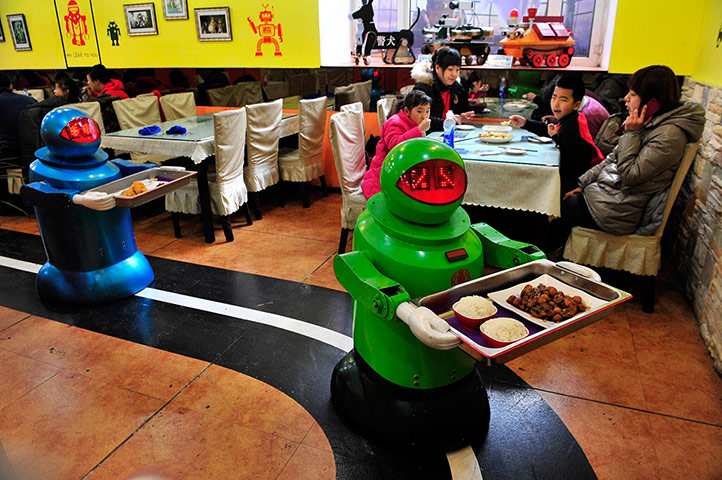 Robot Restaurant: Robots deliver dishes to customers at a Robot Restaurant in Harbin