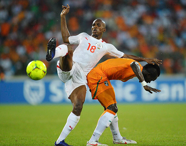African Nations: Charles Kabore of Burkina Faso vies with Cheik Tiote of Ivory Coast