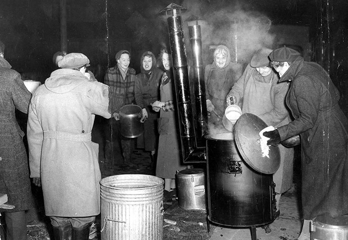 Floods 1953: Flood Victims From Canning Town London Being Fed By A W.v.s. Soup Kitchen