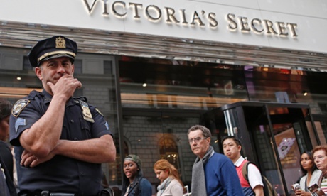A police officer stands in front of the Victoria's Secret store in Manhattan where a foetus was discovered in the bag of a teenage girl.
