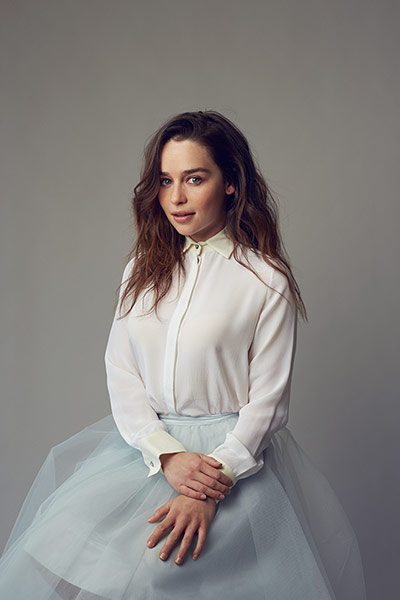 Emilia Clarke: Emilia wears a white silk top by Jonathan Simkhai