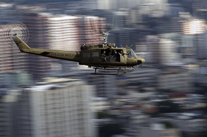 Favela clearance: A Brazilian military police helicopter flies over the Lins favela (shantyto