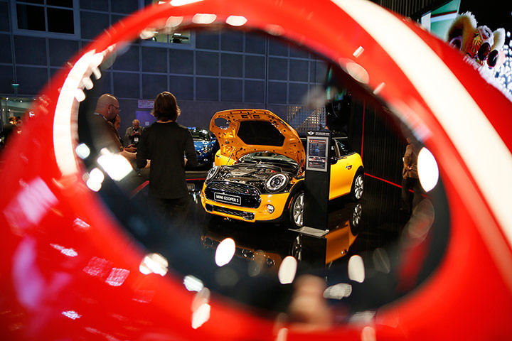 L.A. and Tokyo Motor Show: People look at a Mini Cooper in LA