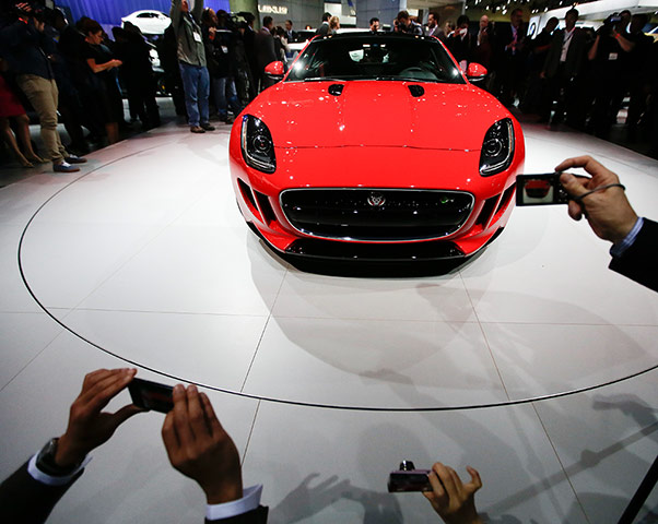 L.A. and Tokyo Motor Show: Attendees take pictures of the Jaguar F-Type Coupe in LA