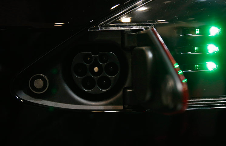 L.A. and Tokyo Motor Show: A battery port of the Tesla Model S car, located near the left side of its 