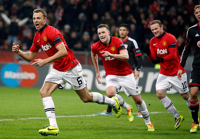 sport//: Manchester United's Evans celebrates