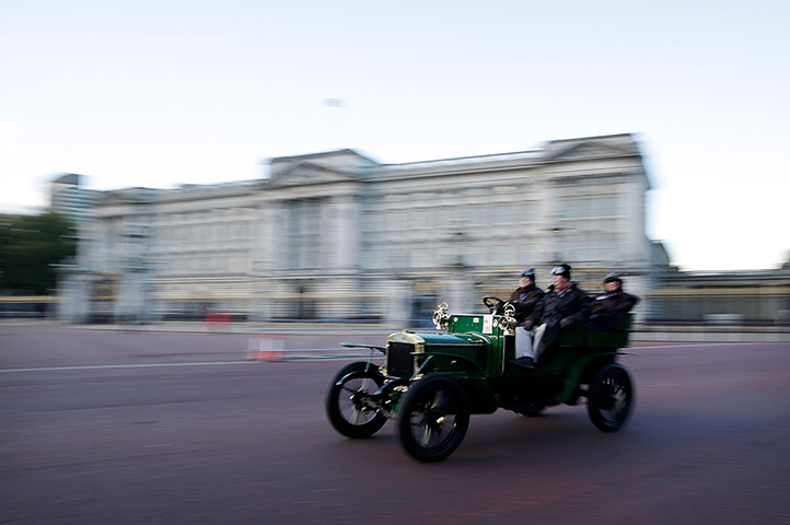 London-Brighton car rally: A car passes Buckingham Palace on it's way to the south coast 
