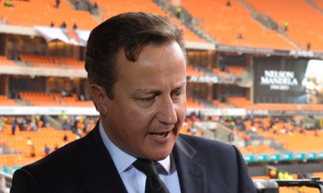 David Cameron gives an interview prior to the memorial service for the late Nelson Mandela at the FNB Stadium, Soweto, on 10 December 2013.