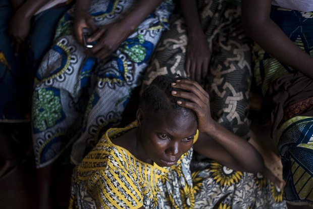 A woman waits at a mobile clinic set up by Doctors Without Borders at a camp for internally displaced persons near Bangui airport, Central African Republic.