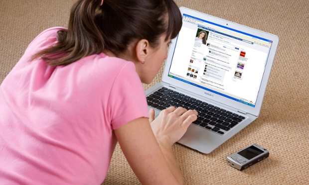 woman looks at computer