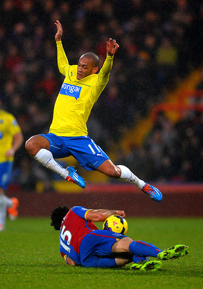Palace v Newcastle: Yoan Gouffran leaps over Mile Jedinak's challenge