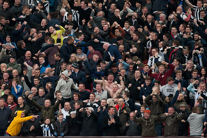 Premiership Saturday: Newcastle supporters celebrate after the goal by Yohan Cabaye against Manch