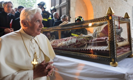 Pope Benedict XVI stands by the remains of Pope Celestine V in 2009.
