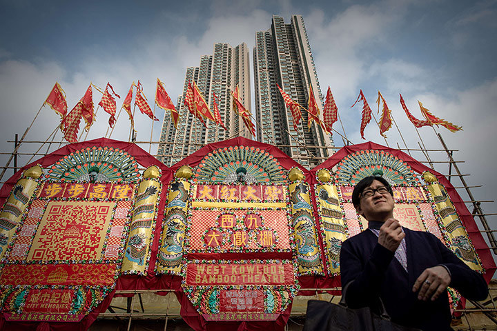 Cantonese opera: A man stands outside the Bamboo Theatre