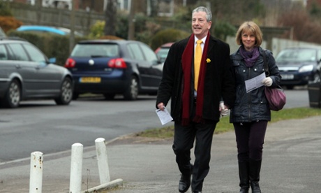 Liberal Democrat candidate Mike Thornton arrives with his wife Peta at a polling station to cast his vote in the by-election in Eastleigh.