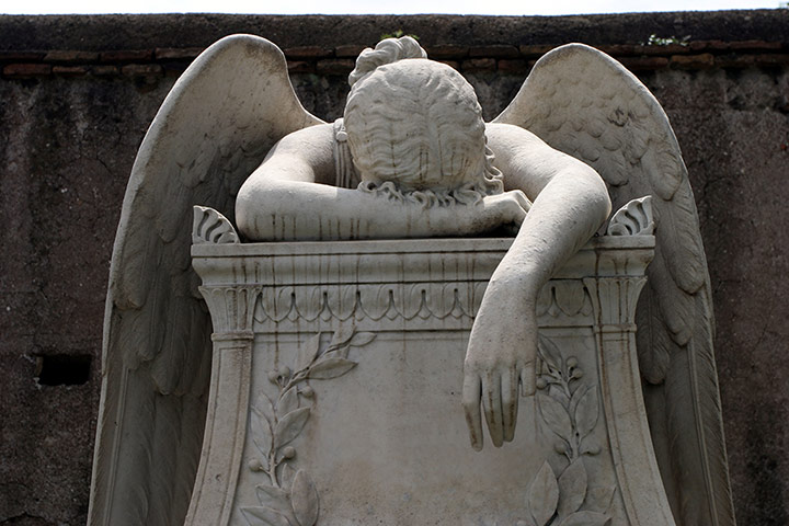  Angel sculpture on a grave at the Protestant cemetery in Rome Italy