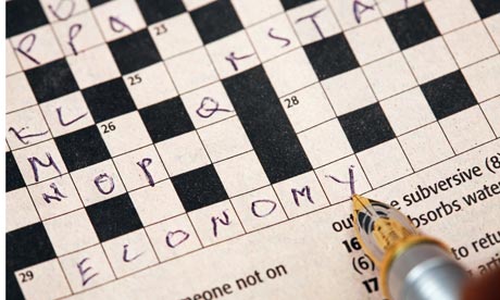 Pen on crossword puzzle, close up