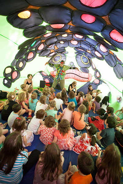Adelaide Festival Day 3: Children are told a story inside the inflatable frog