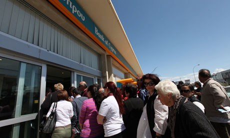 Long line of customers crowding the bank entrance.