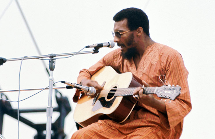 Richie Havens on stage at Woodstock Music and Arts Fair in 1969