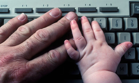 babys and mans hand on keyboard