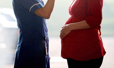 A midwife and a pregnant woman